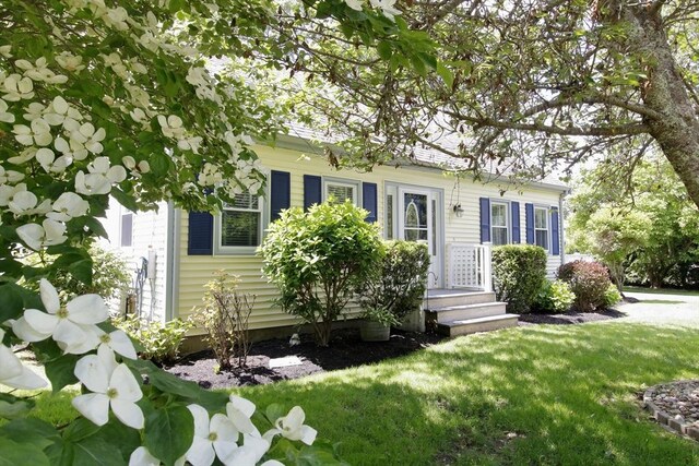 6 Jeffrey Ln, Freetown, MA 02702 - view of property hidden behind natural elements with a front yard