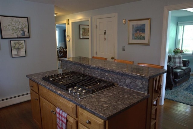 6 Jeffrey Ln, Freetown, MA 02702 - kitchen with stainless steel gas cooktop, dark wood finished floors, a kitchen island, and dark stone countertops