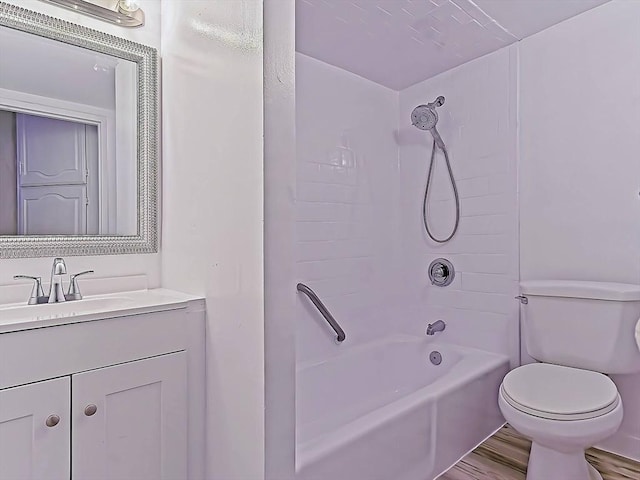 full bathroom with toilet, shower / bathing tub combination, wood finished floors, and vanity