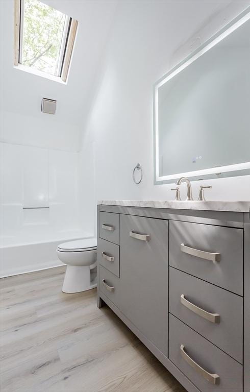 22 Frenier Ave Unit 9, Attleboro, MA 02703 - full bathroom featuring toilet, vanity, and wood finished floors