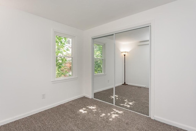 22 Frenier Ave Unit 9, Attleboro, MA 02703 - unfurnished bedroom featuring carpet, a closet, and baseboards