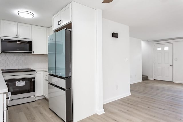 22 Frenier Ave Unit 9, Attleboro, MA 02703 - kitchen featuring freestanding refrigerator, electric range, light wood-style floors, white cabinetry, and decorative backsplash