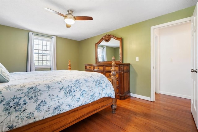 bedroom with hardwood / wood-style flooring and ceiling fan