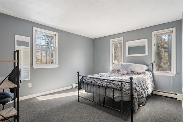 bedroom featuring a baseboard radiator and carpet