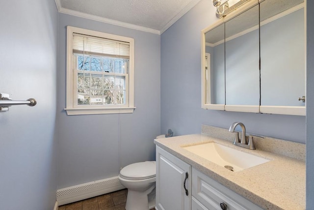 bathroom featuring crown molding, vanity, a textured ceiling, a baseboard radiator, and toilet