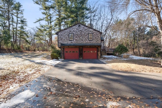 view of side of home with a garage