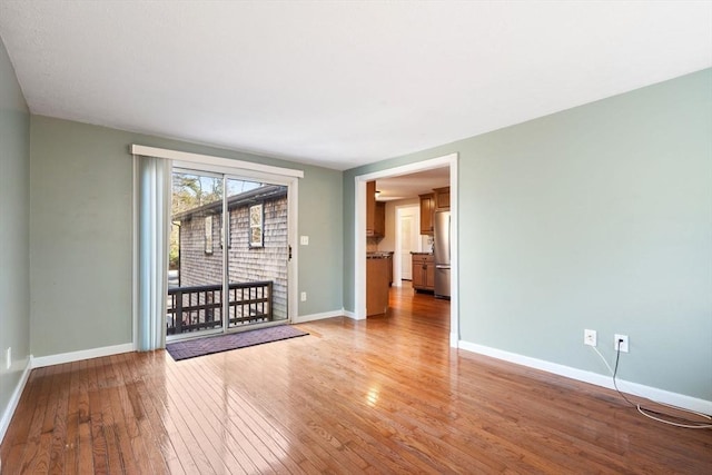 spare room featuring light hardwood / wood-style flooring