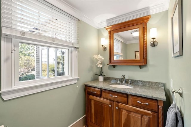 bathroom featuring ornamental molding and vanity