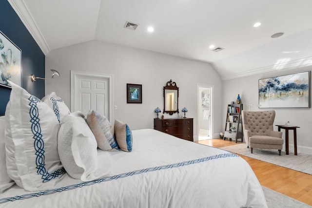 bedroom featuring lofted ceiling, visible vents, recessed lighting, and wood finished floors