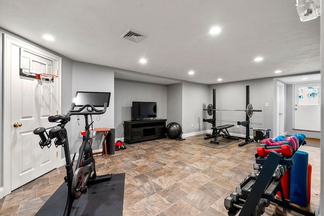 exercise area with recessed lighting, stone finish flooring, visible vents, and baseboards