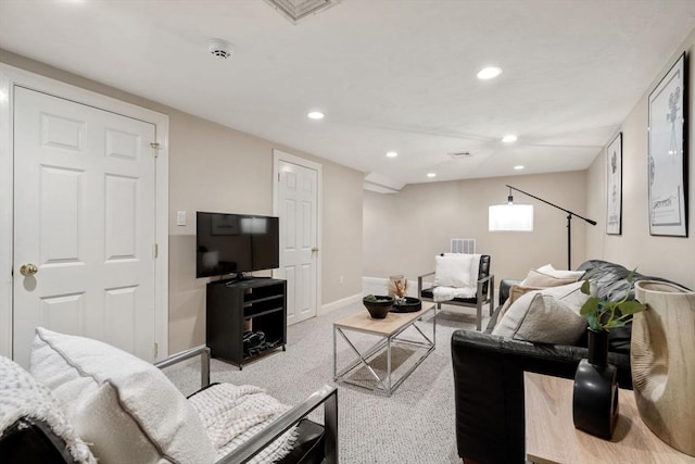 living area featuring carpet floors, visible vents, baseboards, and recessed lighting