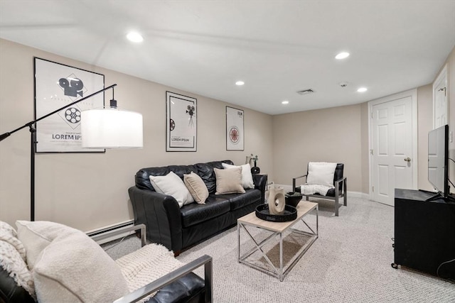 living room featuring a baseboard heating unit, baseboards, visible vents, and recessed lighting