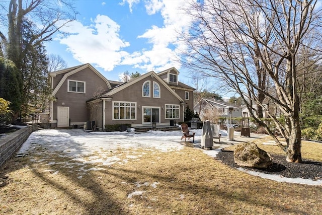 back of property with a patio area and a gambrel roof