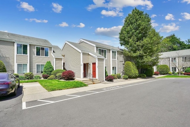 42 Nassau Dr Unit 42, Springfield, MA 01129 - view of front of house with uncovered parking and a residential view