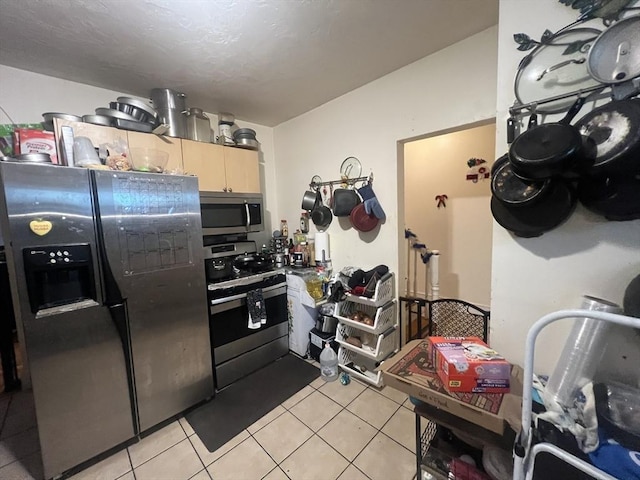 2 Stanton St, Boston, MA 02124 - kitchen with stainless steel appliances and light tile patterned floors
