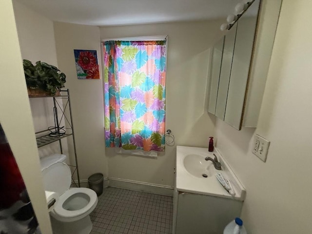 2 Stanton St, Boston, MA 02124 - bathroom with vanity, toilet, and tile patterned flooring