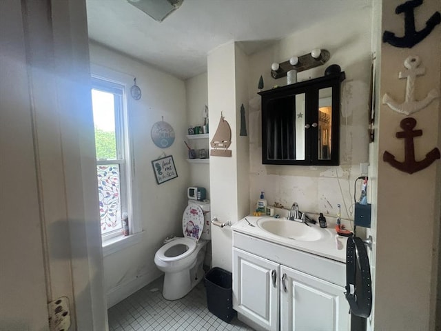 2 Stanton St, Boston, MA 02124 - bathroom with healthy amount of natural light, vanity, toilet, and tile patterned flooring