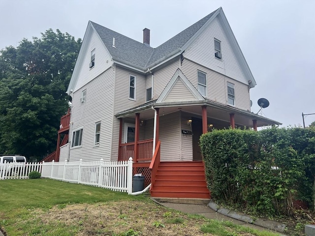 2 Stanton St, Boston, MA 02124 - view of front facade featuring a porch, a chimney, and a shingled roof