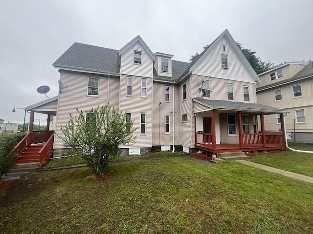 2 Stanton St, Boston, MA 02124 - rear view of house with covered porch, a yard, and a shingled roof