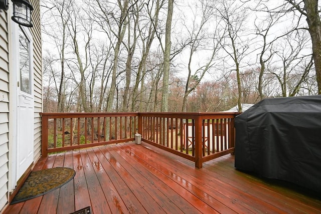 wooden deck with grilling area