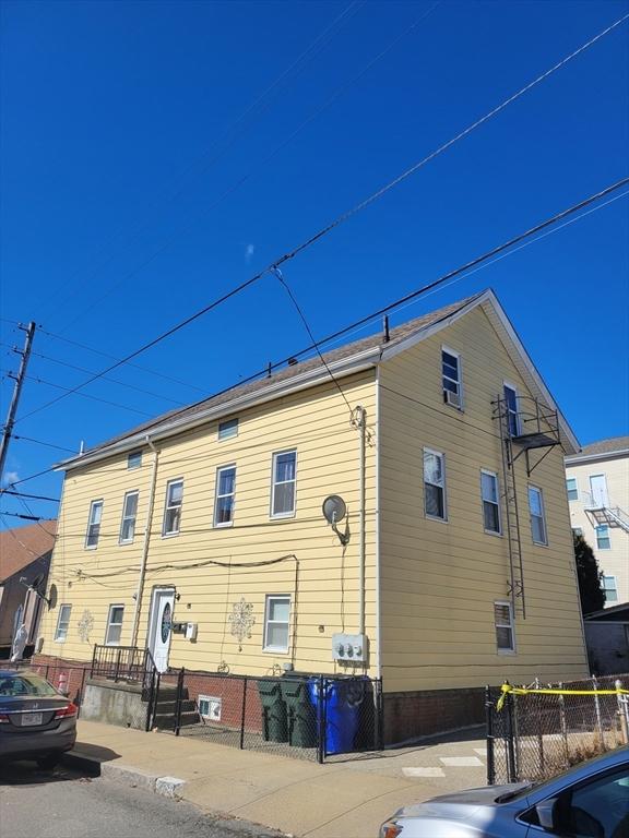 view of side of property with fence