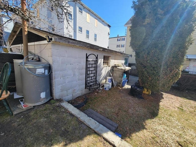 exterior space with concrete block siding