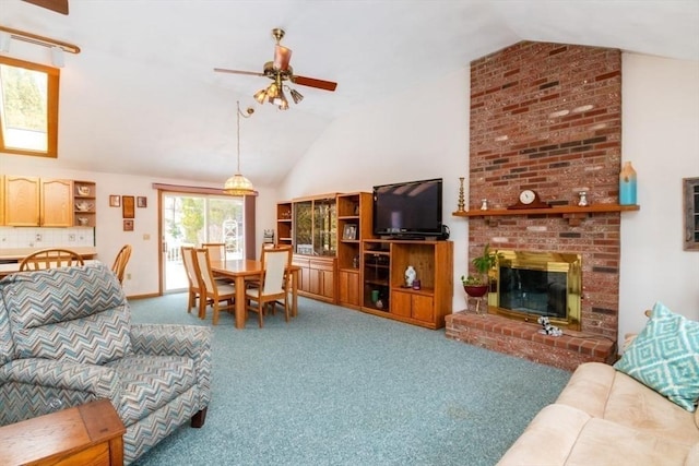 living area featuring lofted ceiling, ceiling fan, a fireplace, and carpet flooring