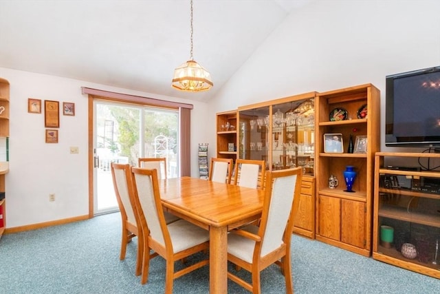 dining area featuring carpet flooring, vaulted ceiling, and baseboards