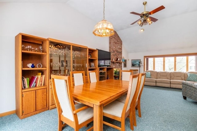 dining space featuring baseboards, ceiling fan, high vaulted ceiling, and carpet flooring