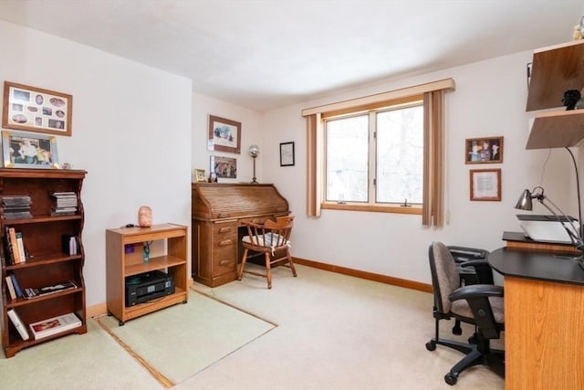 office featuring baseboards and carpet flooring