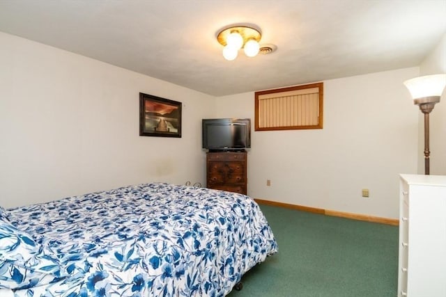 carpeted bedroom featuring baseboards