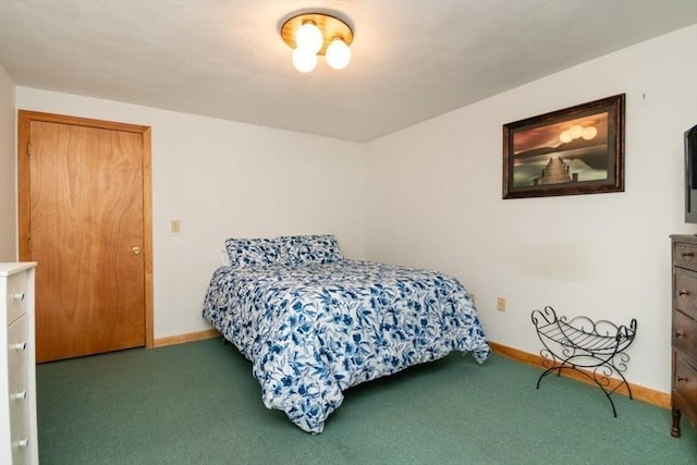 bedroom with carpet floors and baseboards