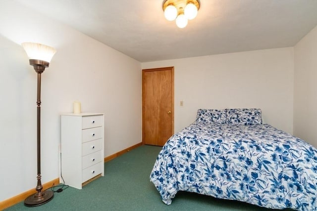 carpeted bedroom with baseboards