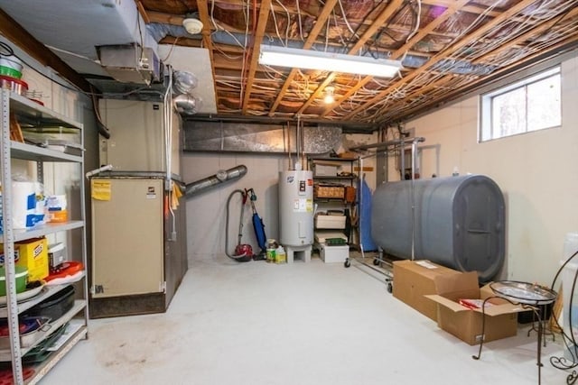 below grade area featuring heating unit, heating fuel, and water heater