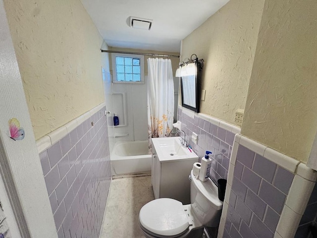 14 Gage St, Worcester, MA 01605 - bathroom with tile walls, vanity, a wainscoted wall, shower / bath combination with curtain, and a textured wall