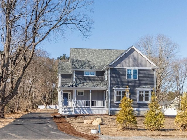 view of front of home with a porch and aphalt driveway