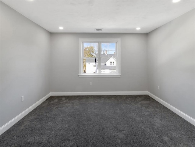 spare room featuring recessed lighting, visible vents, baseboards, and dark colored carpet