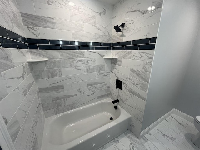 full bath featuring shower / tub combination, toilet, baseboards, and marble finish floor