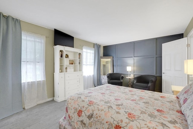 585 Sheridan St Unit 8, Chicopee, MA 01020 - bedroom featuring a decorative wall and carpet flooring
