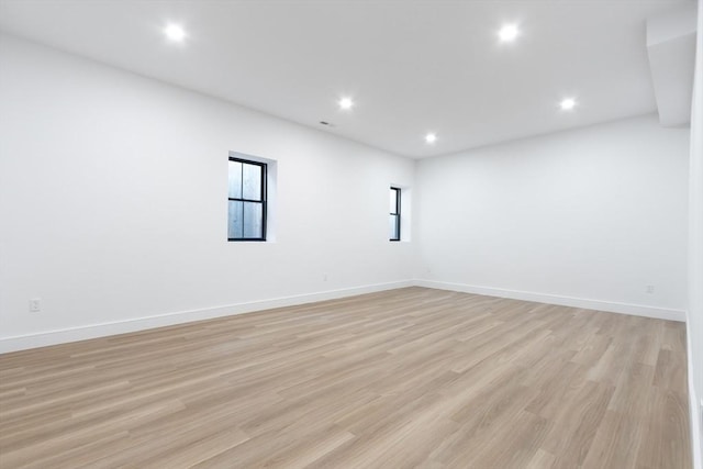 empty room with light hardwood / wood-style flooring