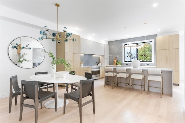 dining room with light hardwood / wood-style floors