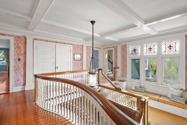 hall featuring wallpapered walls, coffered ceiling, wood finished floors, beam ceiling, and baseboards