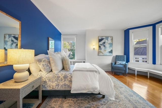 bedroom with wood finished floors