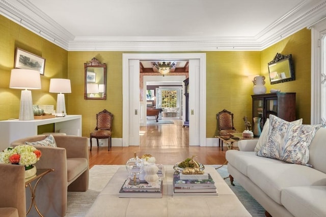 living room featuring crown molding and wood finished floors