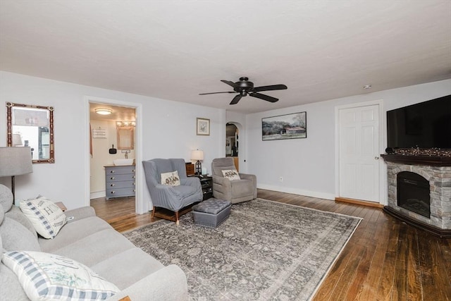 700 S Main St, Bellingham, MA 02019 - living room featuring arched walkways, hardwood / wood-style floors, ceiling fan, and baseboards