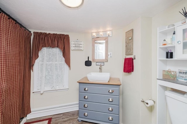 700 S Main St, Bellingham, MA 02019 - bathroom featuring vanity, wood finished floors, toilet, and a shower with shower curtain