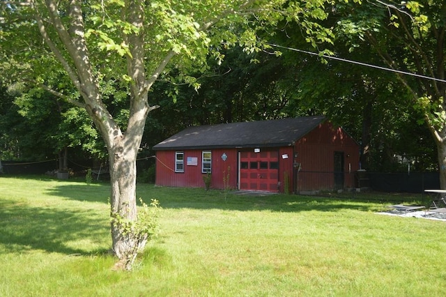 700 S Main St, Bellingham, MA 02019 - view of grassy yard featuring an outdoor structure and a garage