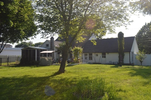 700 S Main St, Bellingham, MA 02019 - rear view of house with a sunroom and a chimney