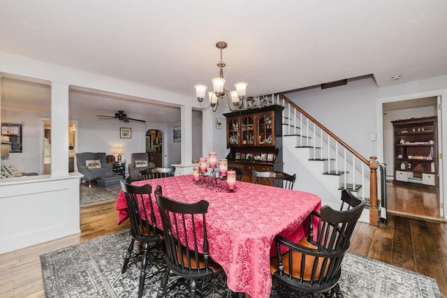 700 S Main St, Bellingham, MA 02019 - dining space featuring a chandelier, hardwood / wood-style flooring, stairway, and ceiling fan