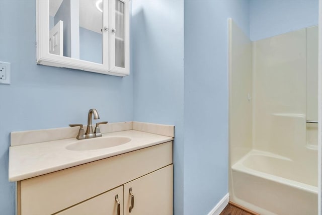 bathroom with vanity and bathtub / shower combination